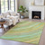 5' X 8' Green Peach And Gold Abstract Washable Indoor Outdoor Area Rug