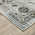 6' X 9' Ivory Grey Charcoal Blue And Taupe Oriental Power Loom Stain Resistant Area Rug