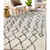 5' X 8' Ivory And Black Geometric Shag Area Rug