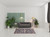 5' X 8' Ivory Orange And Dark Gray Floral Area Rug