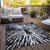 3' X 5' Black Charcoal And Ivory Abstract Washable Indoor Outdoor Area Rug