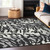 5' X 8' Black Gray And Ivory Animal Print Washable Indoor Outdoor Area Rug