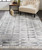 5' X 8' Gray And Black Geometric Hand Woven Area Rug With Fringe