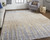 10' X 13' Tan And Blue Abstract Distressed Area Rug