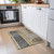 2' X 3' Gray Green and Gold Abstract Washable Non Skid Indoor Outdoor Area Rug