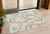 3' X 5' Ivory Gold And Brown Abstract Washable Indoor Outdoor Area Rug