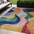 5' X 8' Green Orange And Pink Abstract Washable Indoor Outdoor Area Rug