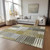 5' X 8' Brown Gold And Taupe Striped Washable Indoor Outdoor Area Rug