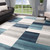 5' X 8' Teal And Ivory Patchwork Area Rug