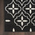 5' X 7' Black And Ivory Geometric Indoor Outdoor Area Rug