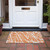 2' X 3' Orange and White Abstract Washable Non Skid Indoor Outdoor Area Rug