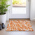 2' X 3' Orange and White Abstract Washable Non Skid Indoor Outdoor Area Rug