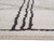 5' X 7' Ivory And Black Geometric Area Rug