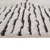 5' X 7' Ivory And Black Geometric Area Rug