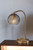 19" Antiqued Brass Metal Desk Lamp With Light Gray Swirl Globe Shade