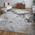 7' X 10' Ivory Black And Gray Abstract Area Rug