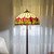 62" Brown Two Light Traditional Shaped Floor Lamp With Red Flowers Stained Glass Dome Shade