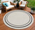 8' Ivory And Black Round Indoor Outdoor Area Rug