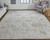 8' X 10' Tan Ivory And Orange Floral Hand Knotted Stain Resistant Area Rug