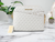 Michael Kors Jet Set X Cross Dome Vanilla/Powder Blush PVC Crossbody Bag - 194900701881