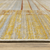 8' X 11' Rust Gold Blue Grey Ivory And Tan Geometric Power Loom Stain Resistant Area Rug With Fringe