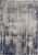 9' X 12' Tan Blue And Ivory Abstract Power Loom Distressed Area Rug