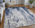 Homeroots Home Decor 10' X 13' Ivory Blue and Black Abstract Power Loom Distressed Area Rug