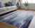 Homeroots Home Decor 4' X 6' Ivory Blue and Black Abstract Power Loom Distressed Area Rug