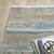 Homeroots Home Decor 5' x 8' Abstract Area Rug, Ivory Beige Grey Blue and Tan, Power Loom Stain Resistant with Fringe