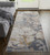 8' Tan Blue And Beige Abstract Distressed Runner Rug