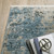 6' X 9' Blue Grey Ivory Light Blue And Dark Blue Abstract Power Loom Stain Resistant Area Rug With Fringe - 606114617686