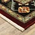 2' X 6' Red Black Beige And Blue Oriental Power Loom Stain Resistant Runner Rug With Fringe