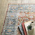 Homeroots Home Decor 7' x 10' Oriental Printed Area Rug, Rust Blue Ivory and Gold, Stain Resistant Non-Skid
