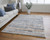 Homeroots Home Decor 9' x 12' Ivory Blue and Orange Striped Power Loom Stain Resistant Area Rug