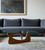 54" Clear and Brown Glass and Wood Triangle Abstract Coffee Table