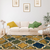 5' X 8' Green Brown And Ivory Quatrefoil Distressed Area Rug
