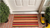 17" X 29" Red Orange and Natural Coir Striped Outdoor Door Mat