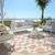 8' Peach And Beige Round Geometric Washable Indoor Outdoor Area Rug