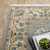 2' X 3' Grey Ivory Orange Teal Green Charcoal Blue And Red Oriental Power Loom Stain Resistant Area Rug With Fringe