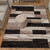 5' X 8' Black Brown And Beige Patchwork Area Rug