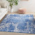 5' X 7' Blue And Ivory Abstract Distressed Area Rug