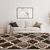 5' X 8' Brown Black And Ivory Quatrefoil Distressed Area Rug