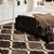 5' X 8' Brown Black And Ivory Quatrefoil Distressed Area Rug