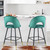 Set Of Two 39" Green Velvet And Black Open Low Back Bar Height Chairs