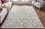 4' X 6' Blue Ivory And Tan Floral Distressed Stain Resistant Area Rug