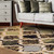 5' X 8' Black And Ivory Quatrefoil Distressed Area Rug