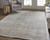 3' X 5' Tan and Ivory Abstract Power Loom Distressed Area Rug With Fringe