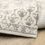 10' X 13' Ivory And Grey Floral Power Loom Stain Resistant Area Rug
