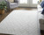 5' X 8' Ivory And Gray Striped Hand Woven Area Rug