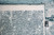 7' X 9' White And Blue Abstract Washable Area Rug With UV Protection